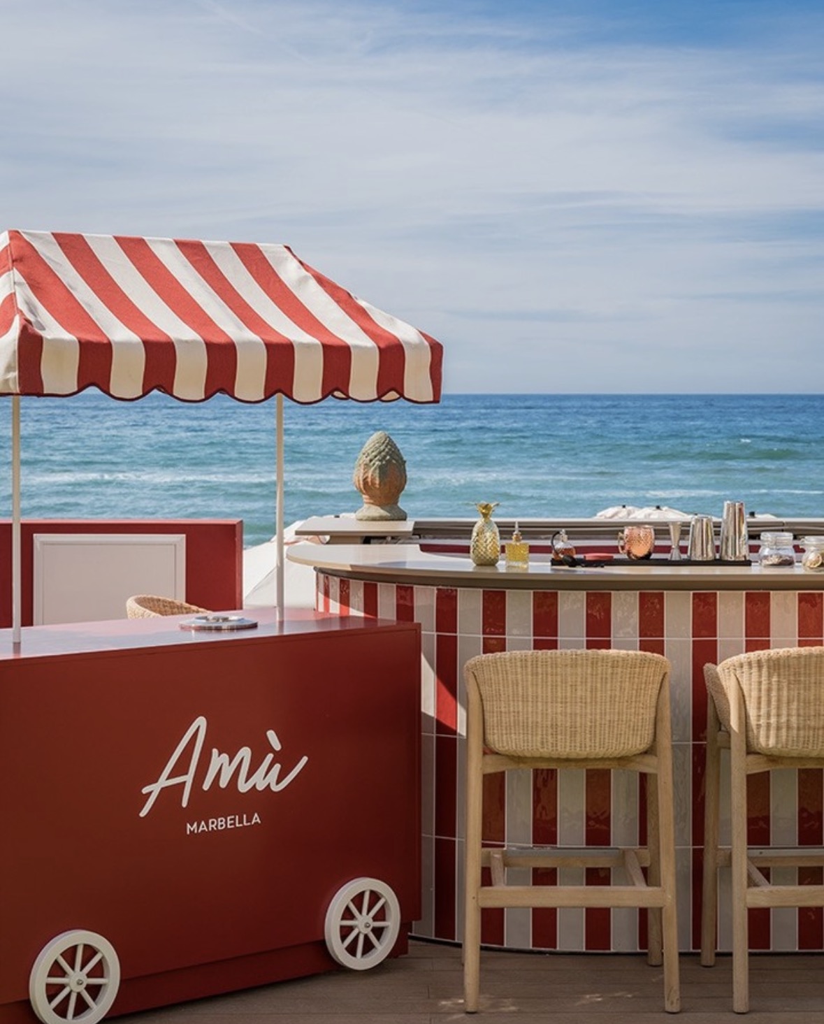AMU Marbella red and white striped bar with sea views