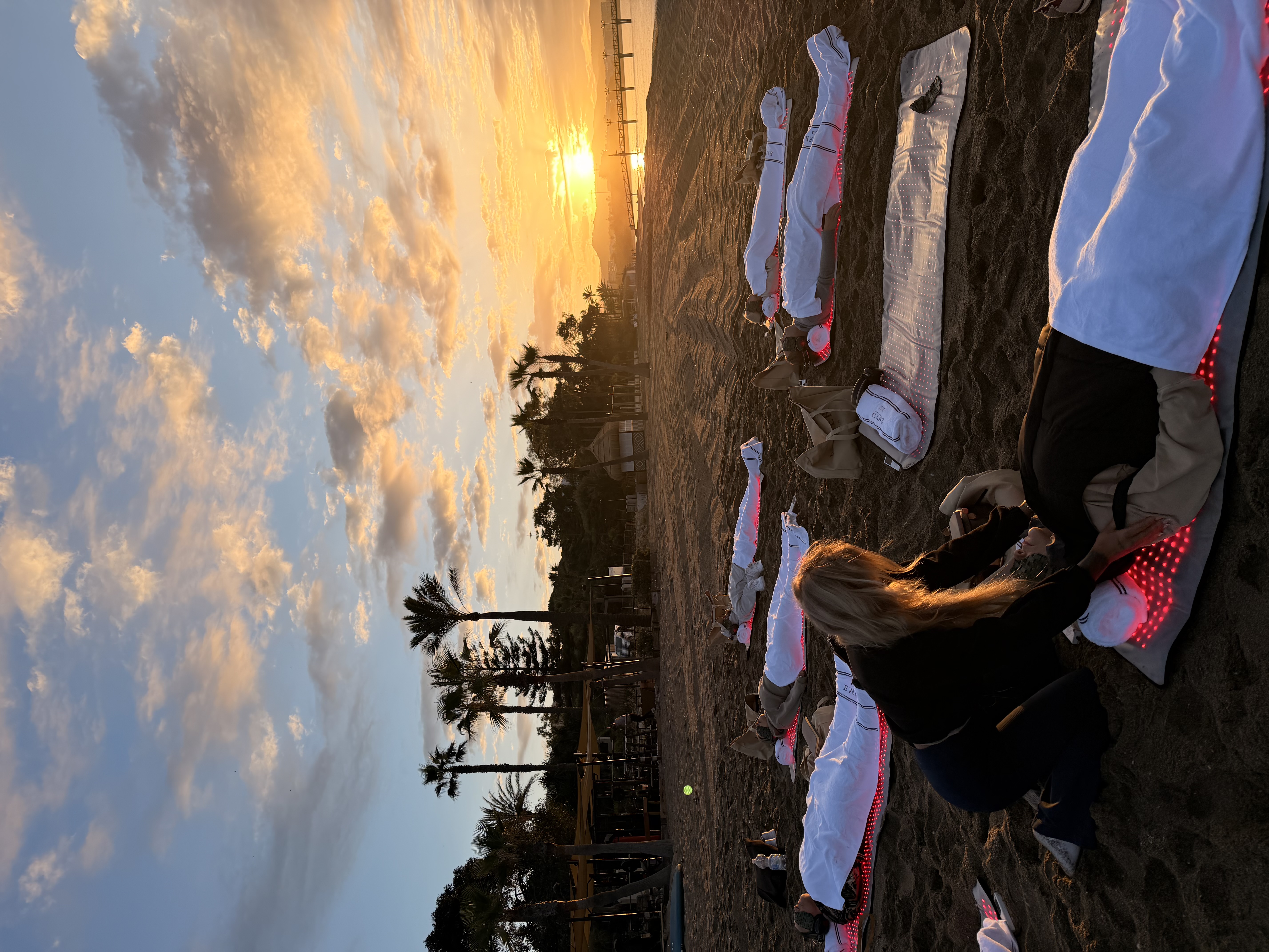 Ember Club sunrise manifestation event on the beach